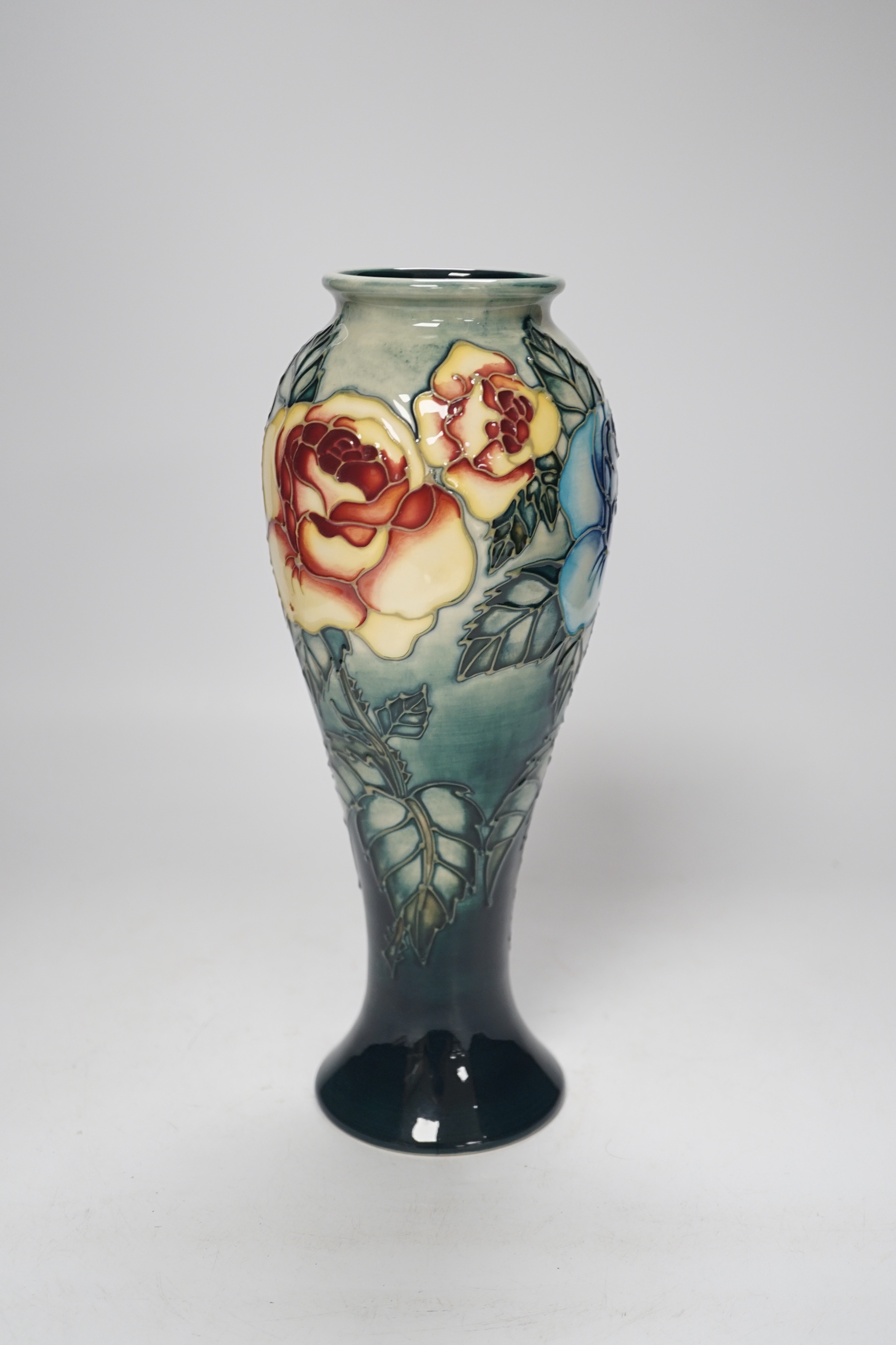 A Moorcroft ‘Rose & Bud’ vase by Sally Tuffin, limited edition 423/500, 27cm high